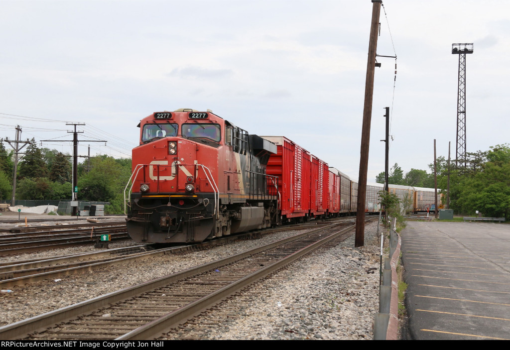 Q11651 pulls down for headroom with three air repeater boxcars at the headend